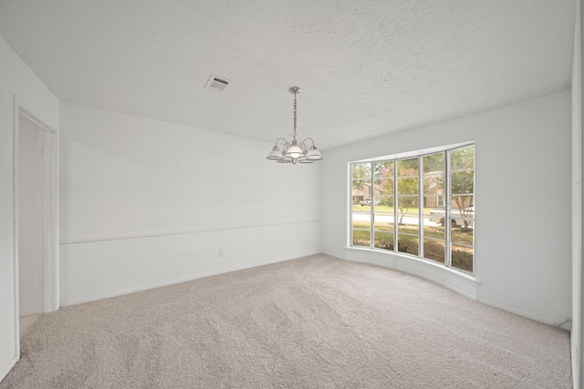 2531 Anzalone Dr, Spring, TX 77373 - empty room featuring carpet, a chandelier, and a textured ceiling