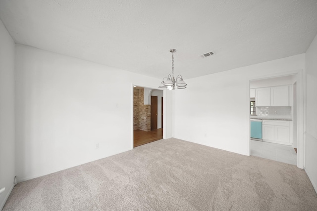 2531 Anzalone Dr, Spring, TX 77373 - unfurnished room with a chandelier and light colored carpet