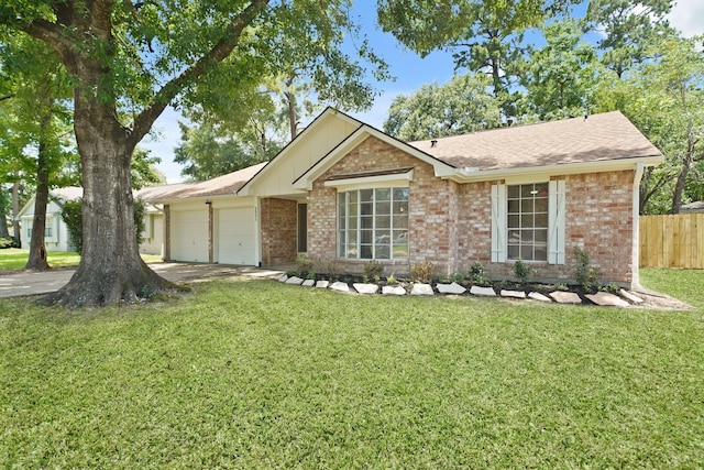 2531 Anzalone Dr, Spring, TX 77373 - single story home with a garage, brick siding, concrete driveway, board and batten siding, and a shingled roof