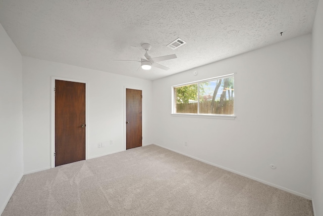 2531 Anzalone Dr, Spring, TX 77373 - unfurnished bedroom featuring carpet floors, a textured ceiling, and a ceiling fan