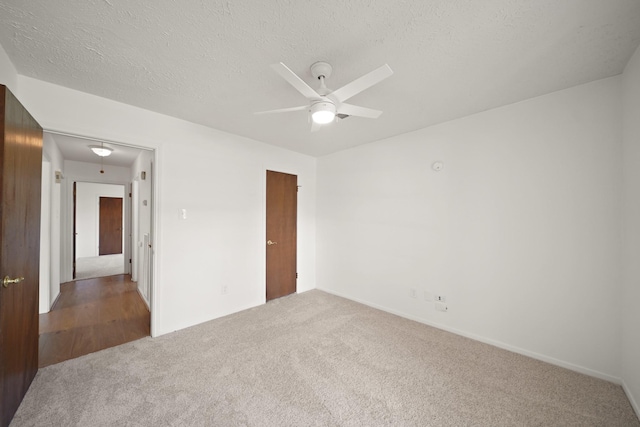 2531 Anzalone Dr, Spring, TX 77373 - unfurnished bedroom with carpet, a textured ceiling, and a ceiling fan