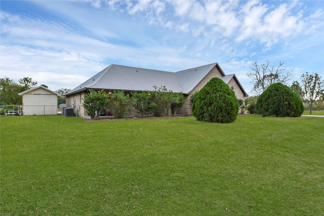 10802 4th 1/2 St, Santa Fe, TX 77510 - view of side of property with a lawn and a metal roof