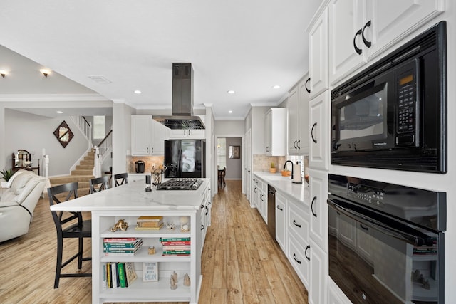 8522 Hillsboro Pl, Sugar Land, TX 77479 - kitchen with black appliances, island range hood, a kitchen breakfast bar, open shelves, and tasteful backsplash