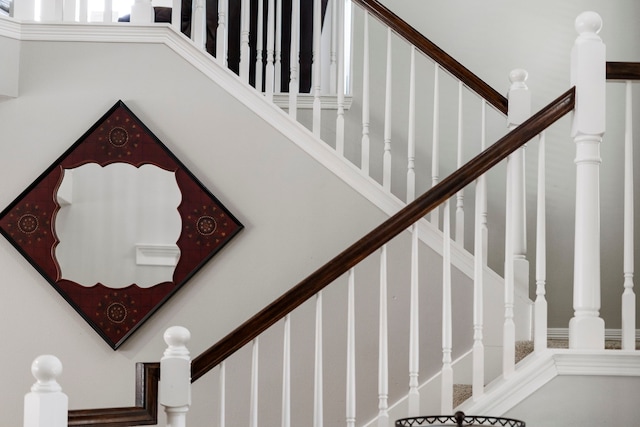 8522 Hillsboro Pl, Sugar Land, TX 77479 - staircase featuring a high ceiling