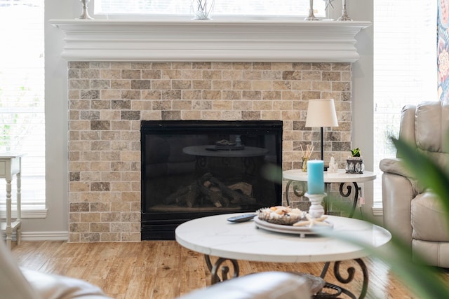 8522 Hillsboro Pl, Sugar Land, TX 77479 - detailed view of a glass covered fireplace and wood finished floors