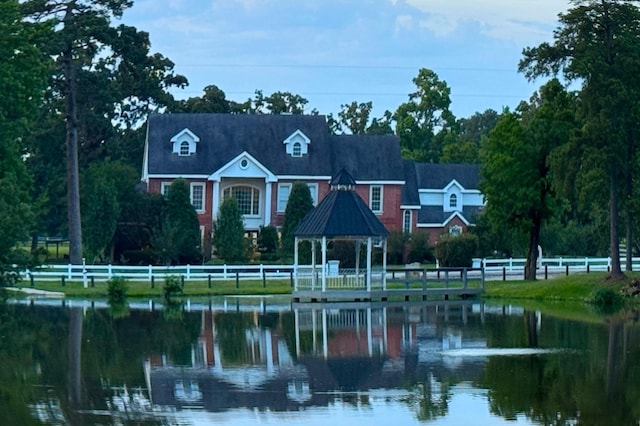 15203 Wildwood Cir, Magnolia, TX 77354 - view of front facade with a gazebo and a water view