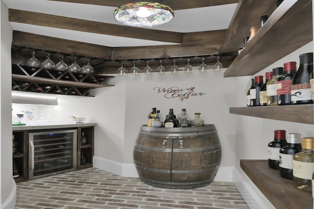 15203 Wildwood Cir, Magnolia, TX 77354 - wine room featuring a dry bar, wine cooler, and brick flooring