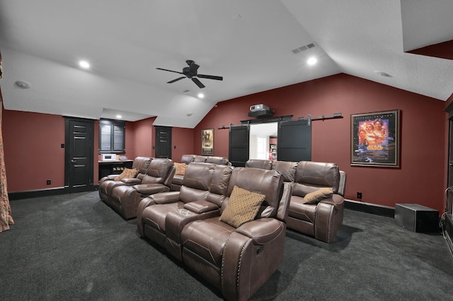 15203 Wildwood Cir, Magnolia, TX 77354 - cinema featuring lofted ceiling, dark carpet, a ceiling fan, a barn door, and recessed lighting