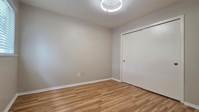 3018 Sherborne St, Pearland, TX 77584 - unfurnished bedroom featuring light wood-style floors and a closet