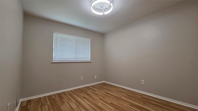 3018 Sherborne St, Pearland, TX 77584 - unfurnished room with wood finished floors and baseboards