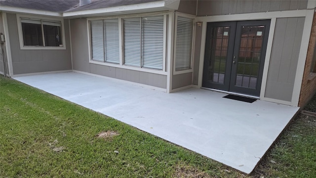 3018 Sherborne St, Pearland, TX 77584 - doorway to property featuring french doors, a patio, and roof with shingles