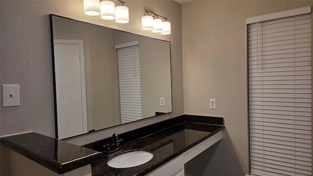 3018 Sherborne St, Pearland, TX 77584 - bathroom featuring vanity and a textured wall