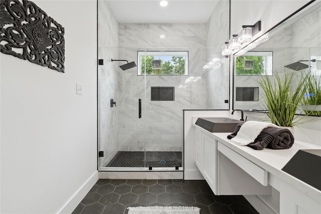 3022 Drew St, Houston, TX 77004 - bathroom featuring a marble finish shower, vanity, tile patterned flooring, and recessed lighting
