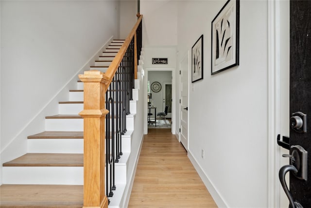 3022 Drew St, Houston, TX 77004 - entryway with light wood-style flooring and stairway