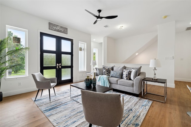 3022 Drew St, Houston, TX 77004 - living area with french doors, a ceiling fan, and light wood finished floors