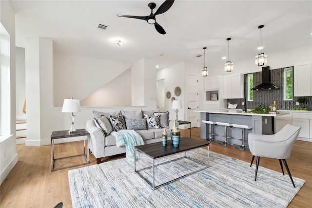 3022 Drew St, Houston, TX 77004 - living area with ceiling fan and light wood finished floors