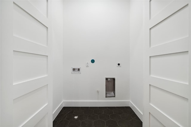 3022 Drew St, Houston, TX 77004 - washroom featuring electric dryer hookup, washer hookup, gas dryer hookup, and dark tile patterned floors