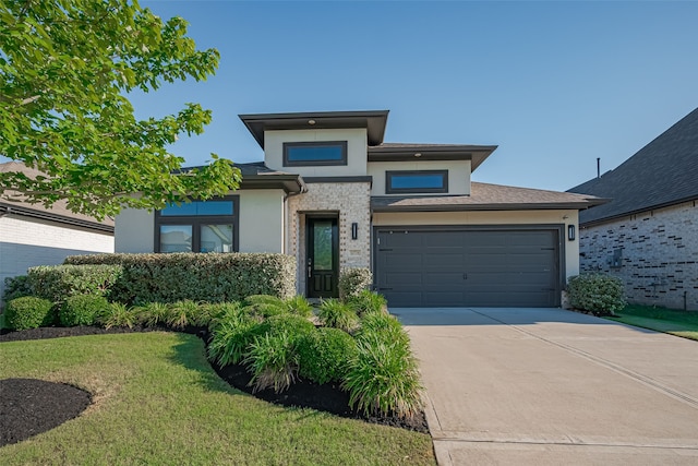 30706 Southern Dewberry Ct, Fulshear, TX 77441 - prairie-style home featuring stucco siding, driveway, and a front lawn