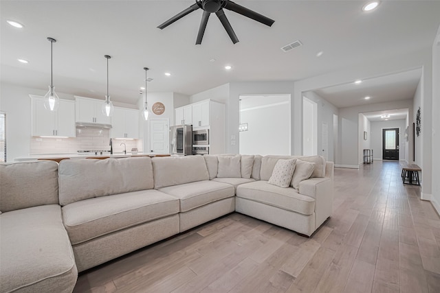 30706 Southern Dewberry Ct, Fulshear, TX 77441 - living room with ceiling fan, light wood-style flooring, and recessed lighting