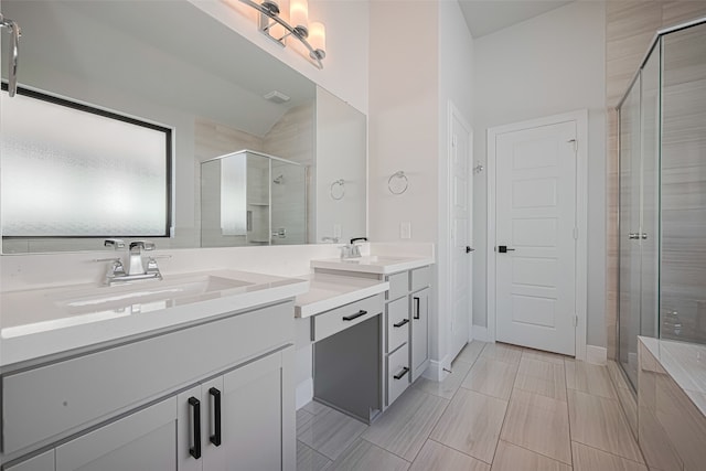 30706 Southern Dewberry Ct, Fulshear, TX 77441 - full bath featuring double vanity, a shower stall, and lofted ceiling