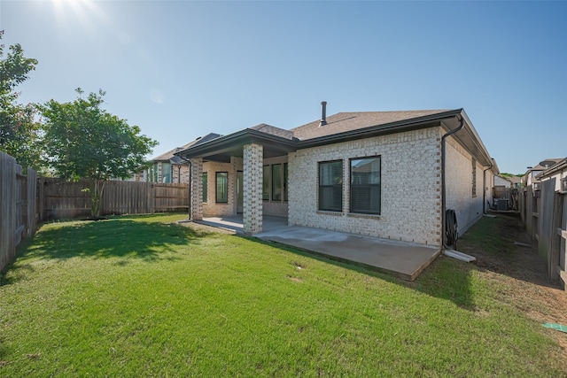 30706 Southern Dewberry Ct, Fulshear, TX 77441 - rear view of house with brick siding, a fenced backyard, and a patio area