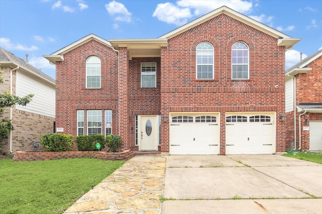 16911 Wortley Dr, Houston, TX 77084 - traditional-style house featuring brick siding, driveway, an attached garage, and a front yard