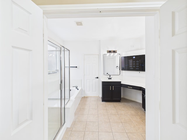 16911 Wortley Dr, Houston, TX 77084 - full bathroom featuring a stall shower, a bath, vanity, and tile patterned floors
