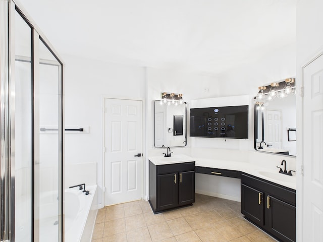 16911 Wortley Dr, Houston, TX 77084 - bathroom featuring double vanity, tile patterned flooring, a garden tub, and a shower stall