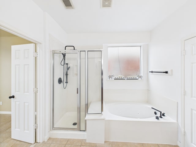16911 Wortley Dr, Houston, TX 77084 - bathroom featuring a whirlpool tub, a stall shower, and tile patterned flooring
