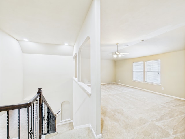 16911 Wortley Dr, Houston, TX 77084 - stairway featuring a ceiling fan, lofted ceiling, and carpet