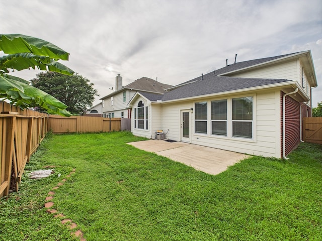 16911 Wortley Dr, Houston, TX 77084 - back of house with a patio, a fenced backyard, and a shingled roof