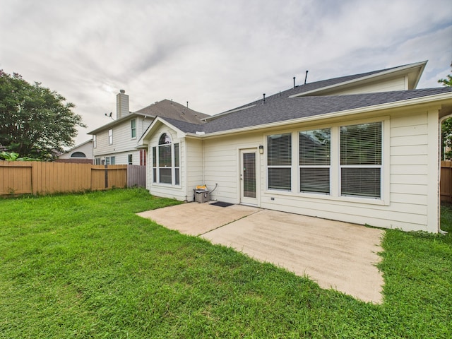 16911 Wortley Dr, Houston, TX 77084 - rear view of house with a patio and a shingled roof