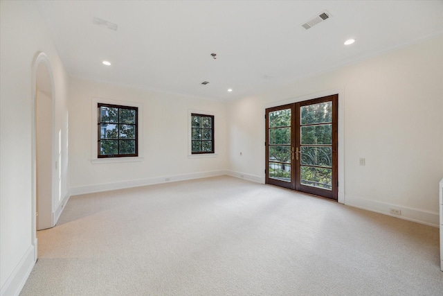 1039 Kirby Dr, Houston, TX 77019 - unfurnished room featuring light carpet, recessed lighting, and french doors