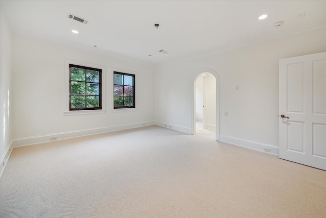 1039 Kirby Dr, Houston, TX 77019 - unfurnished room featuring arched walkways, light carpet, a smoke detector, and recessed lighting