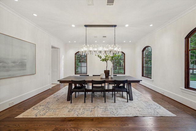 1039 Kirby Dr, Houston, TX 77019 - dining space featuring arched walkways, crown molding, dark wood-type flooring, a chandelier, and recessed lighting