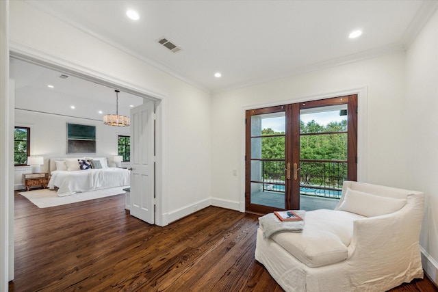 1039 Kirby Dr, Houston, TX 77019 - living area featuring french doors, ornamental molding, plenty of natural light, dark wood finished floors, and recessed lighting