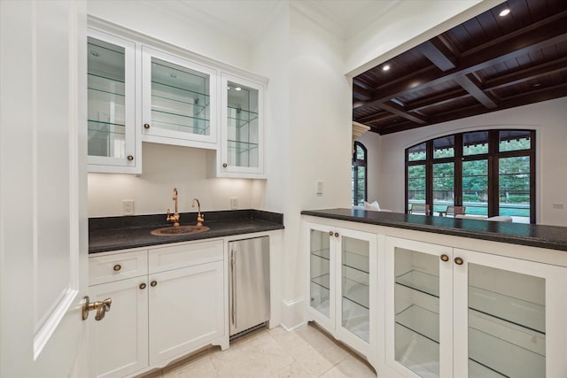 1039 Kirby Dr, Houston, TX 77019 - indoor wet bar with refrigerator, a wooden ceiling with exposed beams, coffered ceiling, ornamental molding, and recessed lighting