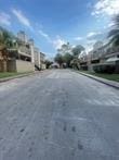 6001 Reims Rd Unit 205, Houston, TX 77036 - view of asphalt road with curbs