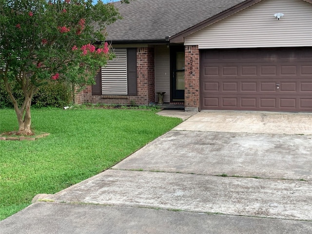 2709 8th Ave N, Texas City, TX 77590 - ranch-style house with brick siding, roof with shingles, a front lawn, concrete driveway, and an attached garage
