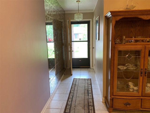 2709 8th Ave N, Texas City, TX 77590 - doorway with light tile patterned flooring, a chandelier, and crown molding