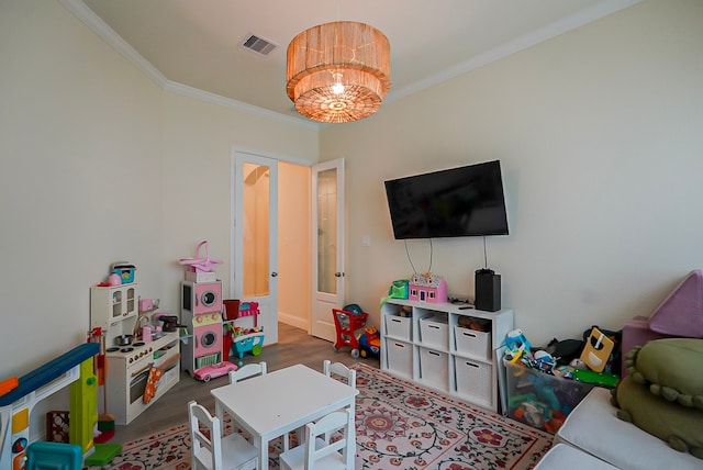 13114 Sierra National Dr, Humble, TX 77346 - rec room featuring ornamental molding and wood finished floors