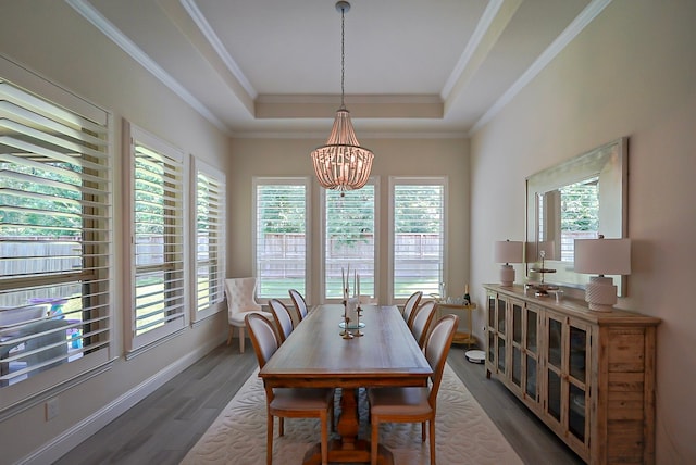 13114 Sierra National Dr, Humble, TX 77346 - dining space featuring a chandelier, a raised ceiling, wood finished floors, and ornamental molding
