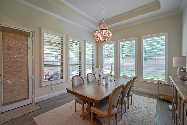 13114 Sierra National Dr, Humble, TX 77346 - dining space with a chandelier, healthy amount of natural light, crown molding, wood finished floors, and a raised ceiling
