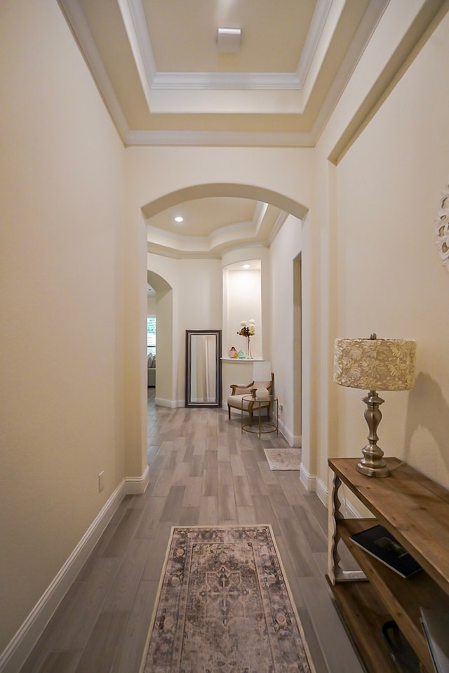 13114 Sierra National Dr, Humble, TX 77346 - corridor with a raised ceiling, arched walkways, ornamental molding, and wood finished floors