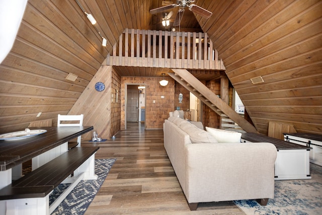 169 N County Road 4945, Etoile, TX 75944 - living area featuring wood ceiling, wooden walls, vaulted ceiling, a ceiling fan, and wood finished floors