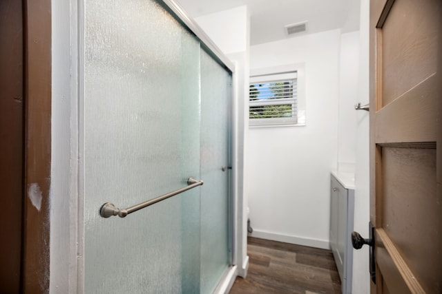 169 N County Road 4945, Etoile, TX 75944 - full bath featuring wood finished floors, a stall shower, and vanity