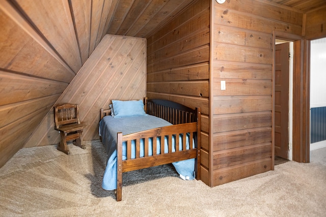 169 N County Road 4945, Etoile, TX 75944 - bedroom with carpet flooring, wood walls, and wooden ceiling