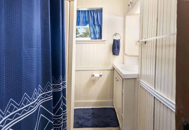 169 N County Road 4945, Etoile, TX 75944 - bathroom with vanity and wood walls