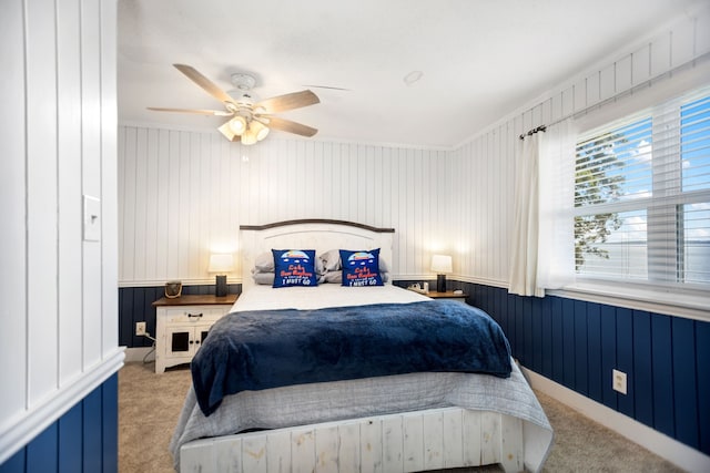 169 N County Road 4945, Etoile, TX 75944 - bedroom with carpet floors, a ceiling fan, and wood walls
