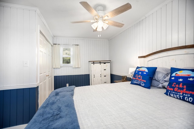 169 N County Road 4945, Etoile, TX 75944 - bedroom with ornamental molding, a ceiling fan, and a closet